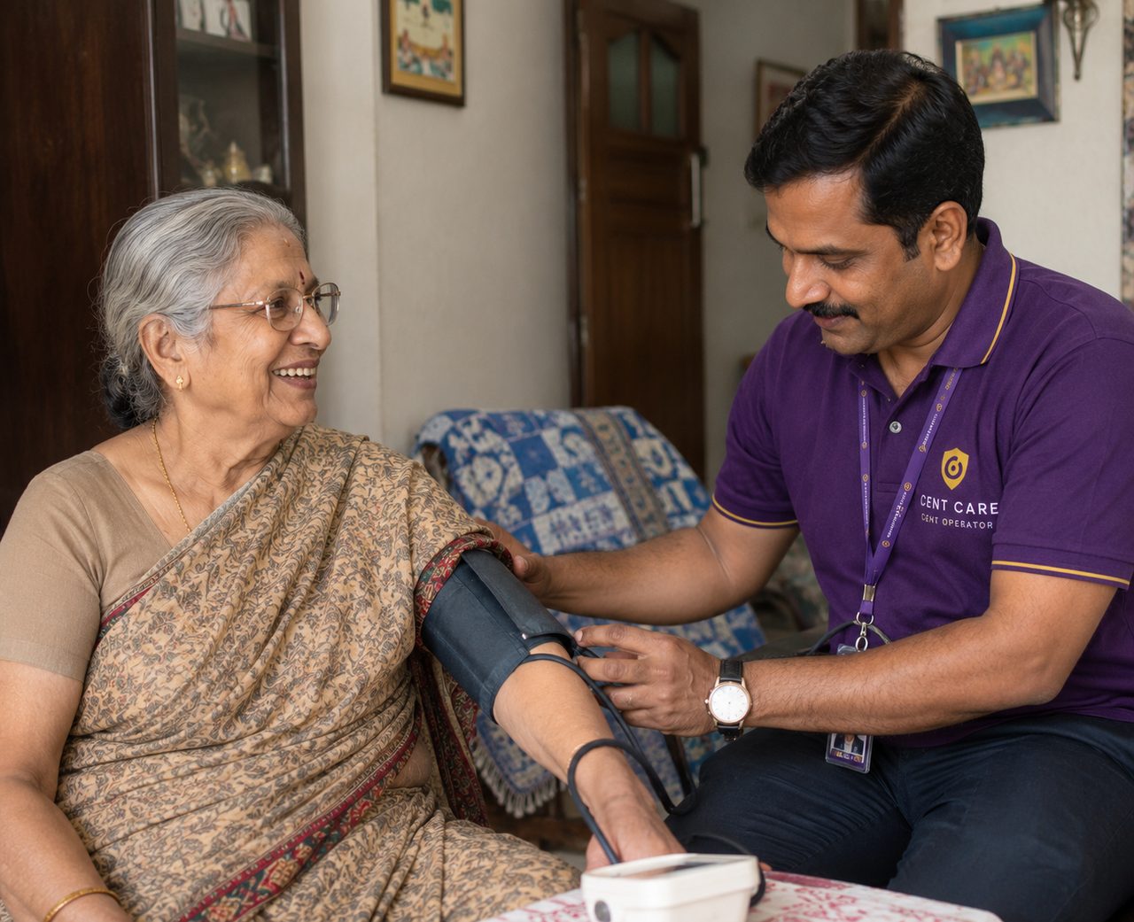 A Cent Care operator recording an elderly woman's blood pressure at her home
