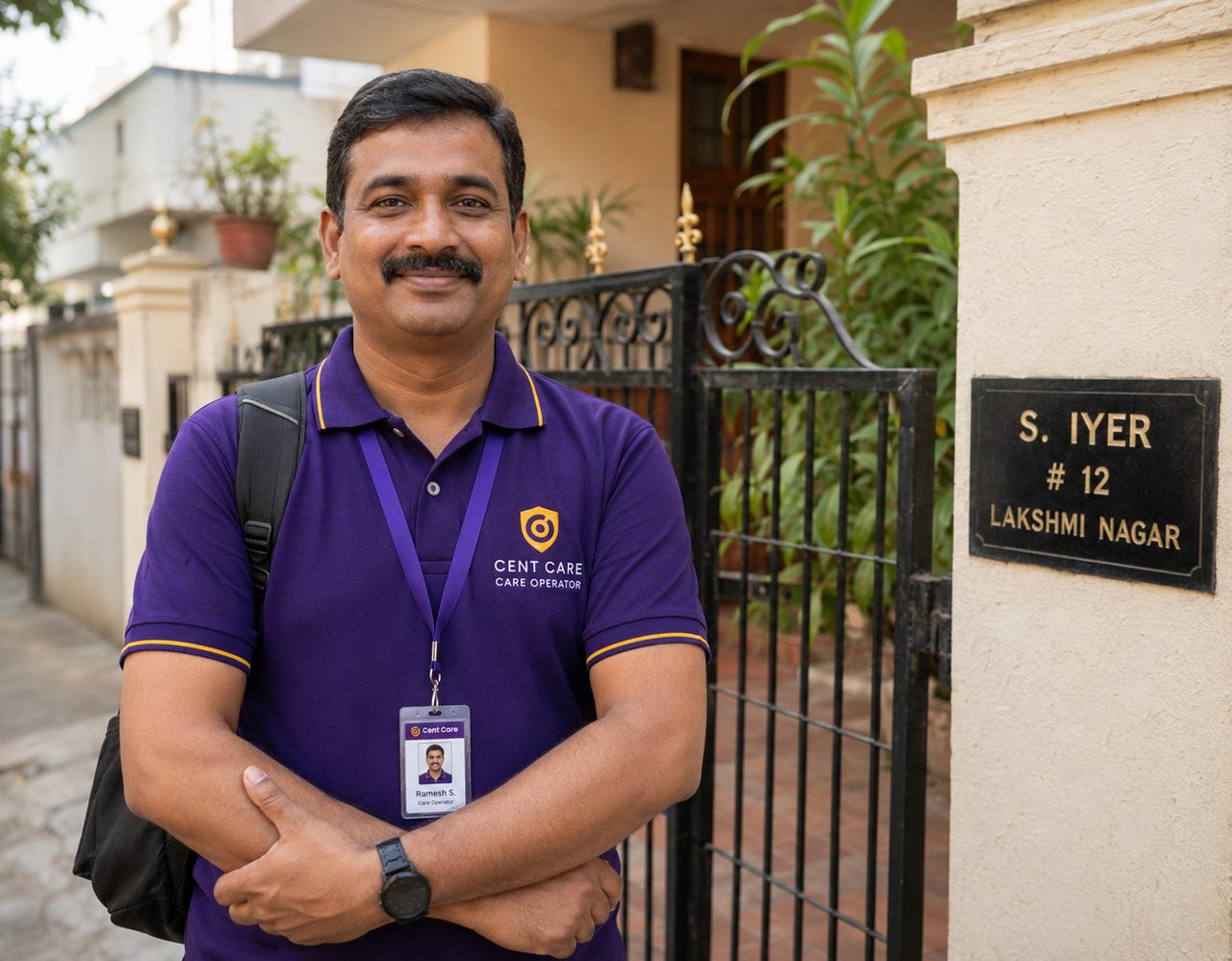 A Cent Care operator in uniform outside a home in Durgapur